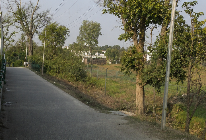 Open residential plots in Pirumdara surrounded by greenery and peaceful environment